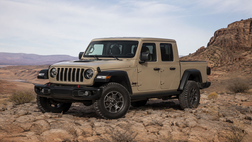 Jeep Wrangler with a soft top parked outdoors beside a hard top Jeep comparison setup