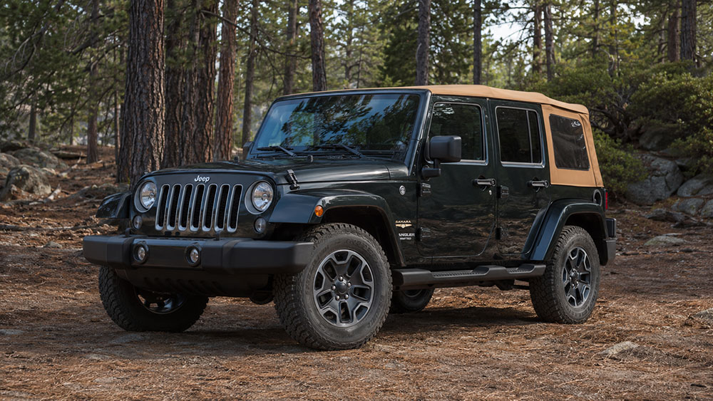Jeep Wrangler with a soft top parked outdoors beside a hard top Jeep comparison setup