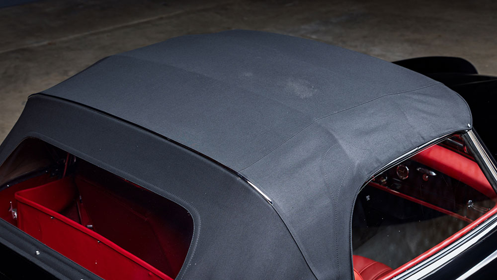 Convertible soft top being restored with fabric-safe color treatment