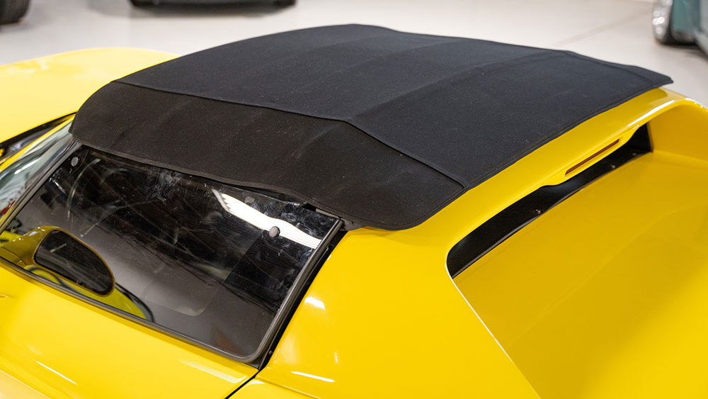 Convertible soft top being restored with fabric-safe color treatment