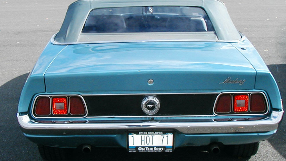 Mustang convertible top being manually closed and secured